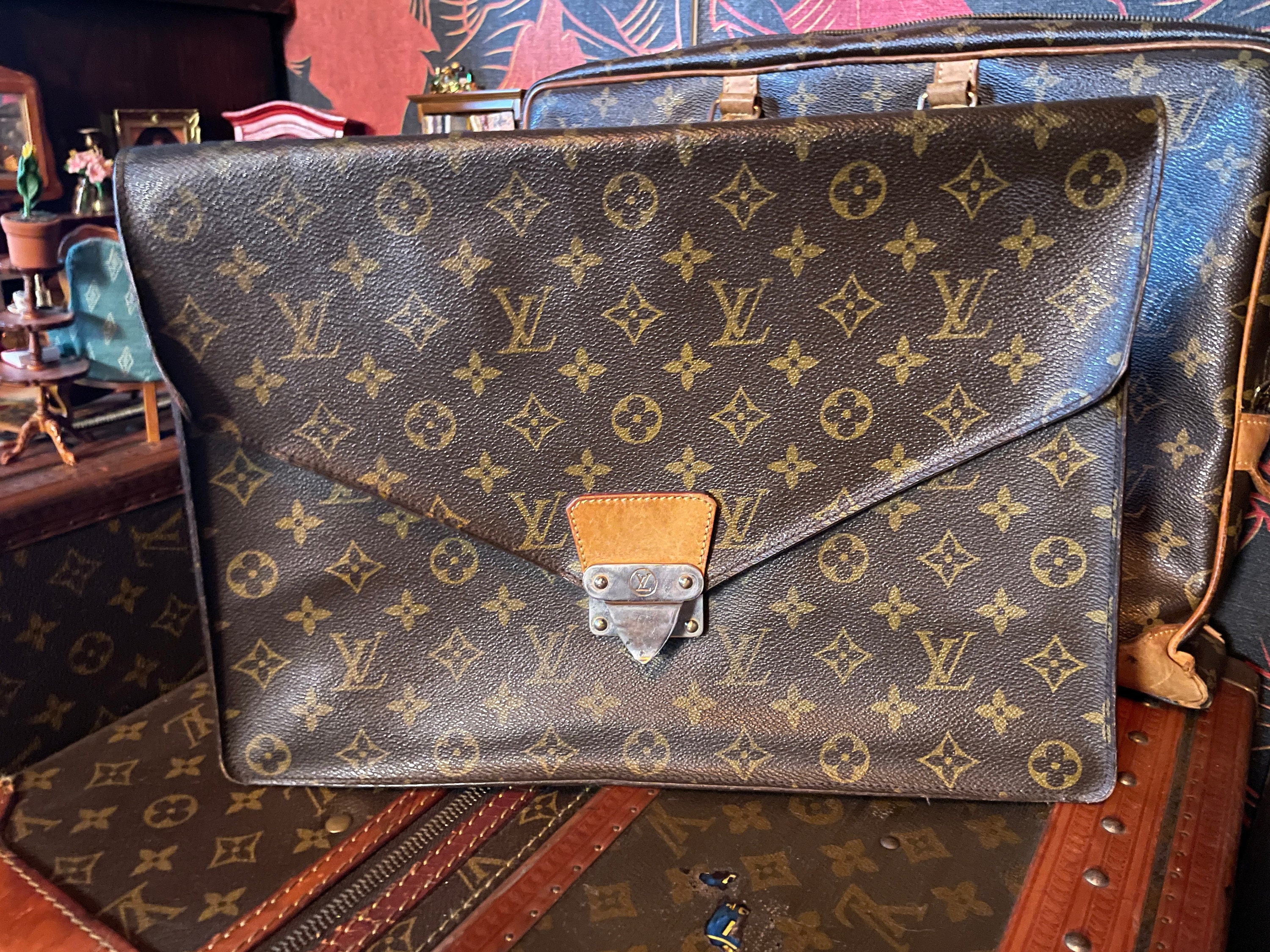 A PERSONALIZED BROWN MONOGRAM CANVAS HARDSIDED SUITCASE, LOUIS VUITTON