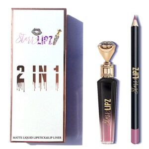 May include: A 2-in-1 matte liquid lipstick and lip liner set in a pink and black colour scheme. The lipstick bottle has a gold top with a large rhinestone. The lip liner is black with a pink lip colour. The packaging is white with gold accents and the text "Starr Lipz 2 in 1 Matte Liquid Lipstick & Lip Liner".