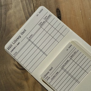 Opbergvakken voor bibliotheekkaarten (2 stuks)