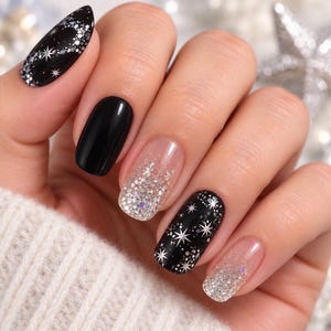 May include: Manicured nails featuring a mix of solid black polish, black polish with silver star and glitter accents, and clear nails with silver glitter gradients. The nail shapes are a combination of rounded and almond styles with a glossy finish.