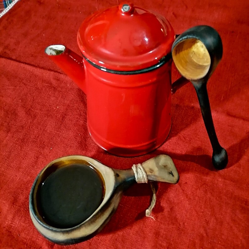 coffee scoop from birch wood and a kuksa cup with coffee handcarved in sweden by witaberget