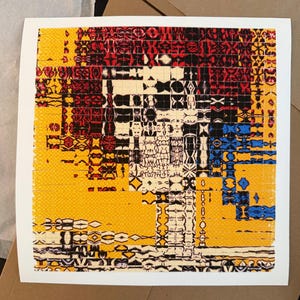 May include: Abstract art print featuring a geometric design in yellow, red, black, and blue. The artwork is composed of a grid-like pattern with various shapes and textures, creating a visually complex composition. The print is on a white background.