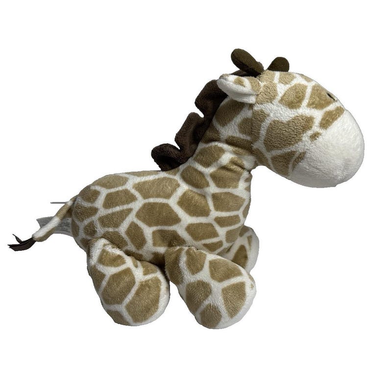 May include: A plush brown and white giraffe toy with a brown nose and ears. The giraffe is lying on its side with its head turned to the right. The giraffe has a white belly and brown spots.