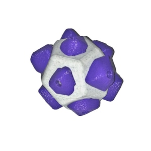 May include: A geometric, spherical object with a white base and purple, triangular protrusions. The object has a textured surface and a symmetrical design, appearing to be 3D-printed.