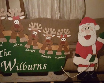 Santa and sled/wooden yard art/holiday decor