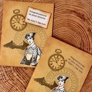 May include: Two vintage-style cards with a brown background and a clock face design. The cards feature a woman in a vintage dress and the text "Congratulations on your divorce. We didn't like her." and "Congratulations on your divorce. We didn't like him."