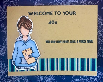 May include: A handmade greeting card with the text "WELCOME TO YOUR 40s". It features an illustration of a woman in a blue hoodie holding a letter. The card has a striped border and the text "YOU NOW HAVE HOME ADVIL & PURSE ADVIL".
