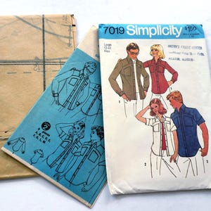 May include: A Simplicity 7019 sewing pattern envelope for shirts in size Large 42-44. The white envelope features illustrations of four individuals wearing button-down shirts with pockets and collars. Includes a blue instruction sheet and brown paper.