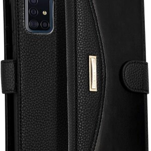 May include: Black leather phone case with a flap that closes with a button. The case has a pocket on the outside for cards or cash.