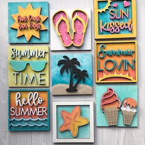 May include: Nine wooden signs with summer-themed designs. The signs feature phrases like "Pool Days Sun Rays", "Summer Time", "Hello Summer", "Sun Kissed", and "Summer Lovin".  Other designs include flip flops, a starfish, palm trees, and ice cream cones.