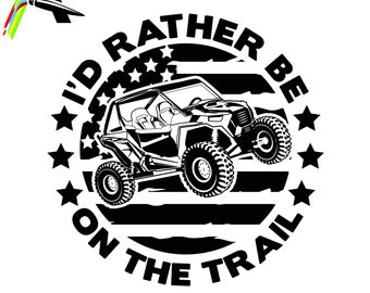 May include: Black and white graphic design of an off-road vehicle driving on a trail with an American flag design. The text reads "I'd Rather Be On The Trail".