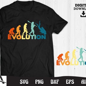 May include: A black t-shirt with a graphic of the evolution of man, ending with a scuba diver. The text "EVOLUTION" is printed below the graphic.