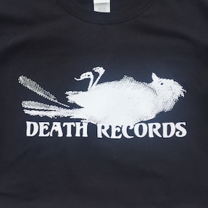 May include: Black t-shirt with a white graphic of a bird with the text "DEATH RECORDS" underneath.