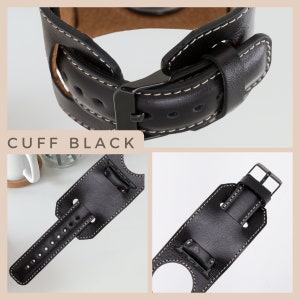 K&ouml;nnte beinhalten: Schwarzes Lederarmband mit wei&szlig;en N&auml;hten und einer Metallschlie&szlig;e. Das Armband ist so konzipiert, dass es um ein Zifferblatt passt und einen Manschetten-Stil hat.