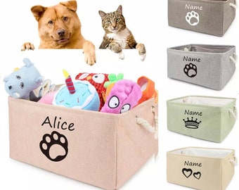 May include: Four beige canvas storage bins with rope handles. Each bin has a different design on the front: a paw print, a paw print, a crown, and two hearts. The bins are labeled "Name" and one bin is labeled "Alice" with a paw print.