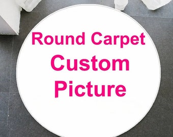 May include: White round carpet with the text "Round Carpet Custom Picture" in pink.