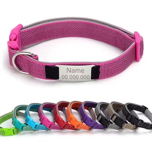 May include: Pink dog collar with a reflective gray trim and a matching pink buckle. The collar includes a silver nameplate with the text "Name" and a phone number. Additional collars in various colors are displayed below.