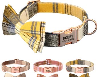 May include: A yellow and black plaid dog collar with a matching bow tie. The collar has a rose gold buckle with the name "BOBBY" and a phone number engraved on it.