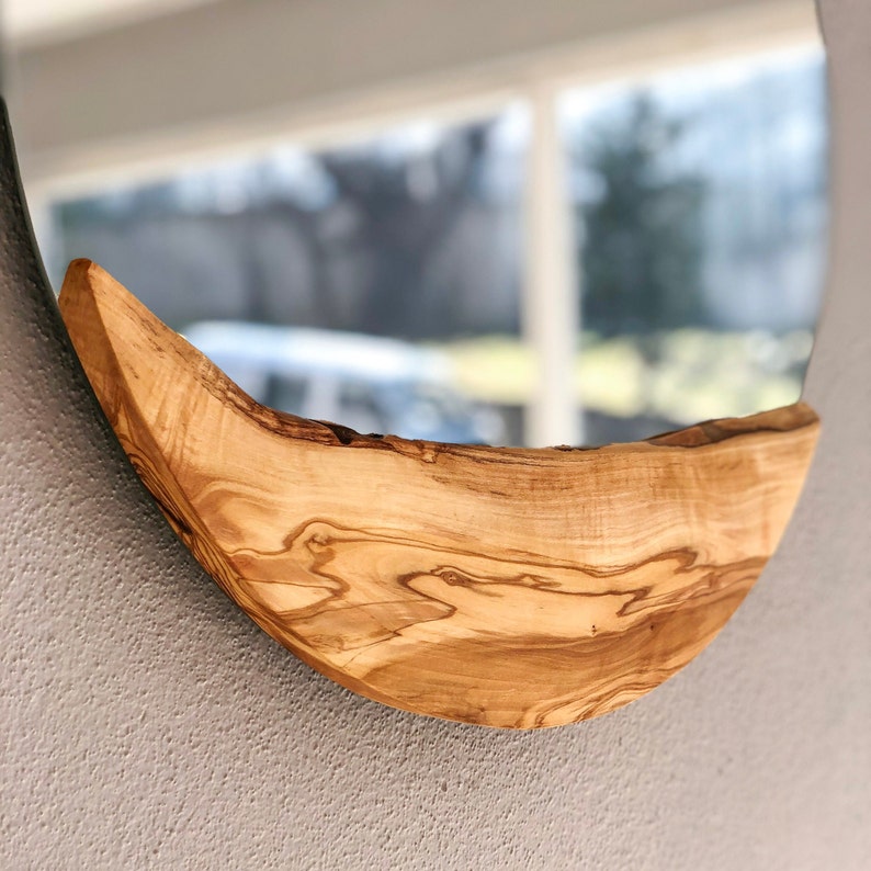May include: A handmade wooden sign with the text "Welcome" in a playful font. The sign features a distressed white background and a dark brown frame, perfect for a front door or entryway. The sign measures approximately 12 inches wide and 6 inches tall.