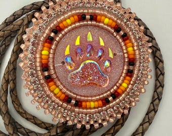 Handmade indigenous style salmon bears paw beaded bolo