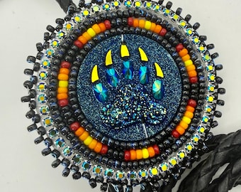 Handmade indigenous style black bears paw beaded bolo