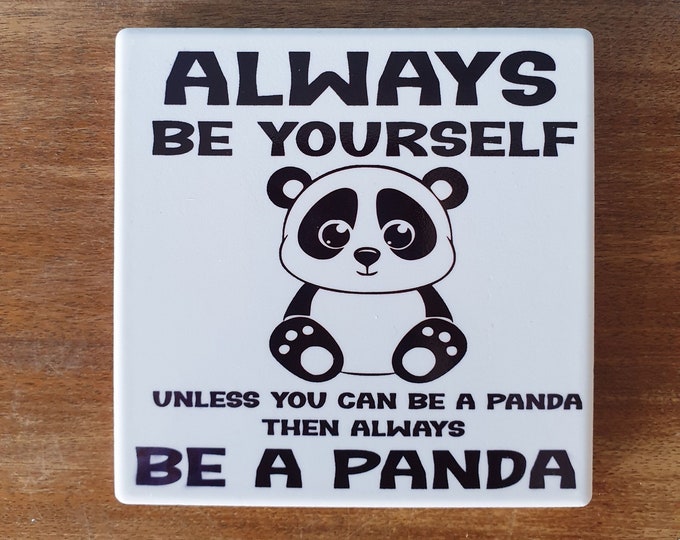 Panda ceramic drinks coaster with the wording 'Always be yourself unless you can be a Panda.Then always be a Panda'.
