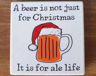 Beer themed ceramic drinks coaster with funny beer themed design 'A beer is not just for Christmas. It is for ale year'
