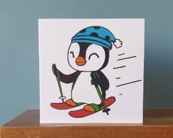 A handmade cut out design skiing penguin Birthday / greetings card.