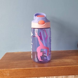 Kids 480ml drinks bottle with popup spout, handle , and personalised with a name and Gymnastics design.