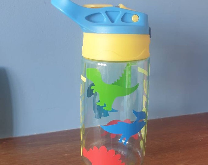 Dinosaurs Kids 480ml pop up spout water bottle with handle personalised with a vinyl name and colourful dinosaurs design.BPA free.