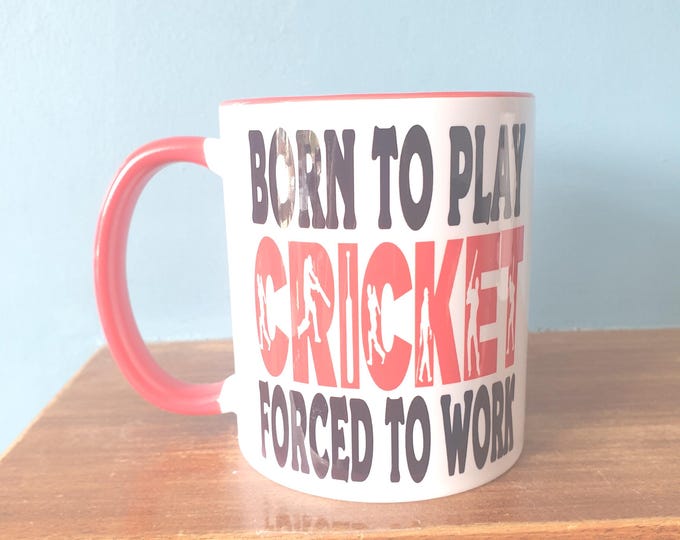 Cricket mug with humourous theme and the wording 'Born to Play Cricket, Forced to work'