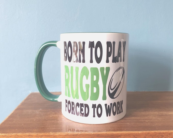 Rugby mug with humourous theme and the wording 'Born to Play Rugby, Forced to work'