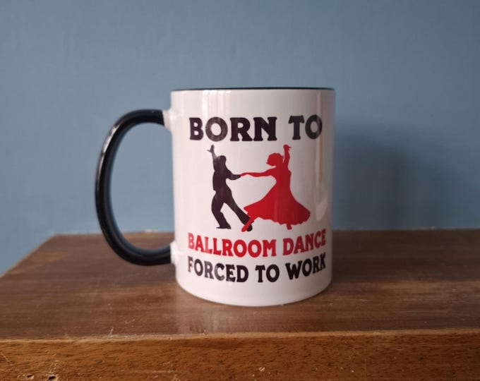 A lovely Ballroom Dancing themed mug with black handle and black inside and the wording 'Born to Ballroom Dance, Forced to work".