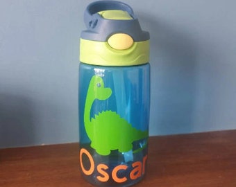 Dinosaur Kids 480ml leak proof pop up spout water bottle with handle personalised with a vinyl name and dinosaur design.