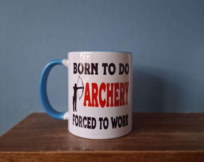 Archery mug with the wording 'Born to do Archery, Forced to work'.