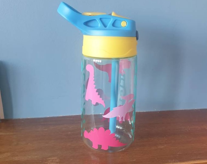 Dinosaurs Kids 480ml pop up spout water bottle with handle personalised with a vinyl name and colourful dinosaurs design.BPA free.