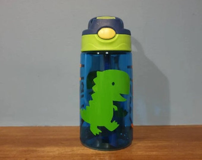Kids 480ml pop up spout water bottle with handle personalised with a name and T-rex design in vinyl. BPA free.