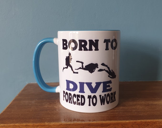 Diving mug with humourous theme and the wording 'Born to Dive, Forced to work'