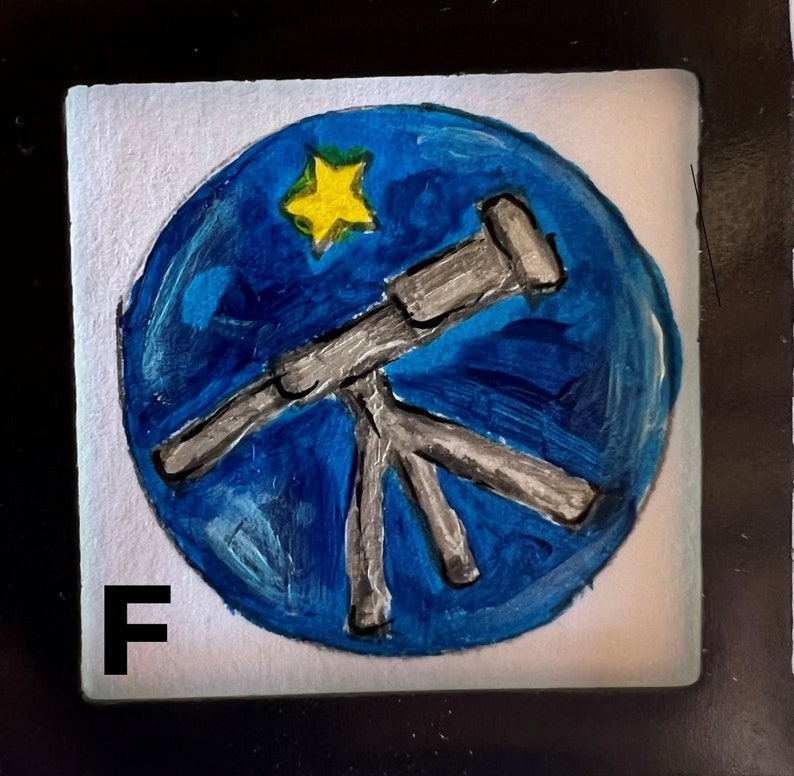 May include: A hand-painted blue circle with a white star and a silver telescope on a white background. The letter "F" is in the lower left corner.