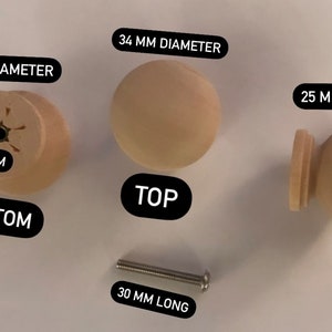 May include: Three wooden knobs with a screw. The top knob is 34 mm in diameter. The bottom knob is 27 mm in diameter. The side knob is 25 mm tall. The screw is 30 mm long.