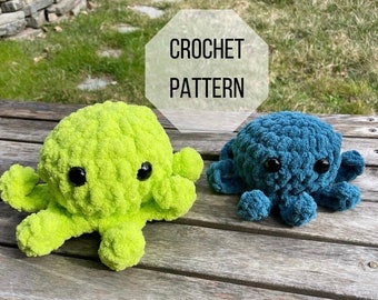 May include: Two crocheted octopus plushies, one green and one blue, with black eyes. The plushies are sitting on a wooden surface. The text "CROCHET PATTERN" is written in white on a white octagon shape.
