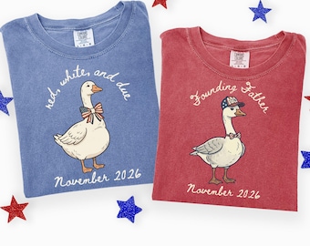 May include: Two Comfort Colors t-shirts, one blue and one red, with goose illustrations. The blue shirt reads "red, white, and due" and the red shirt says "Founding Father". Both shirts have "November 2026" printed below the goose.
