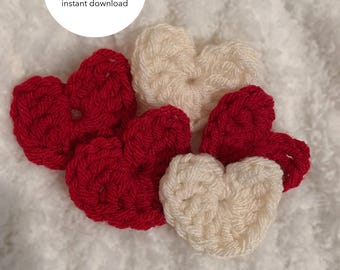 May include: Five crocheted hearts, two red and three white, on a white fluffy surface. The text "CROCHET PATTERN instant download" is on a white circle.