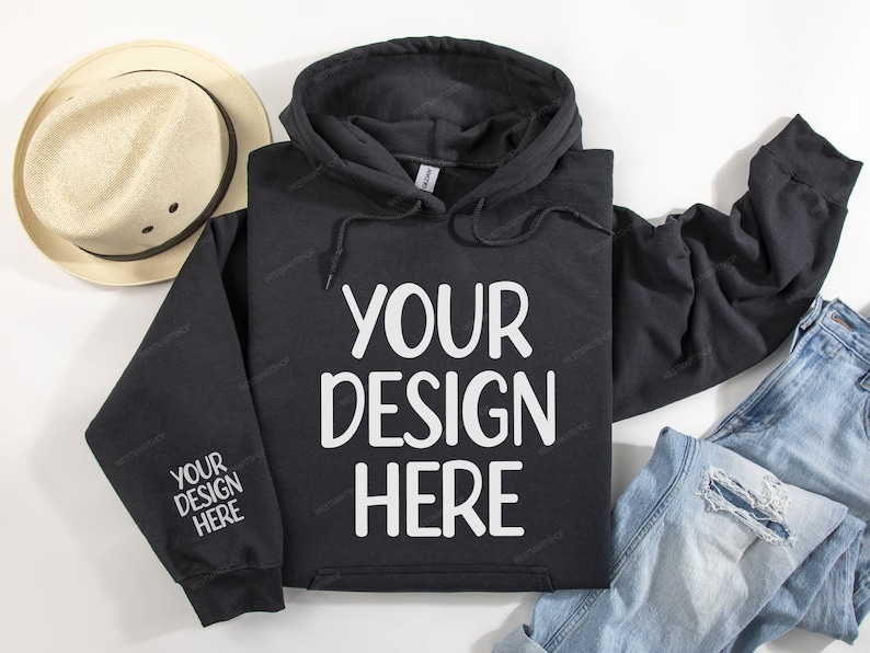 Pode incluir: Camisola de moletom com capuz preta com o texto "YOUR DESIGN HERE" impresso em branco na frente.