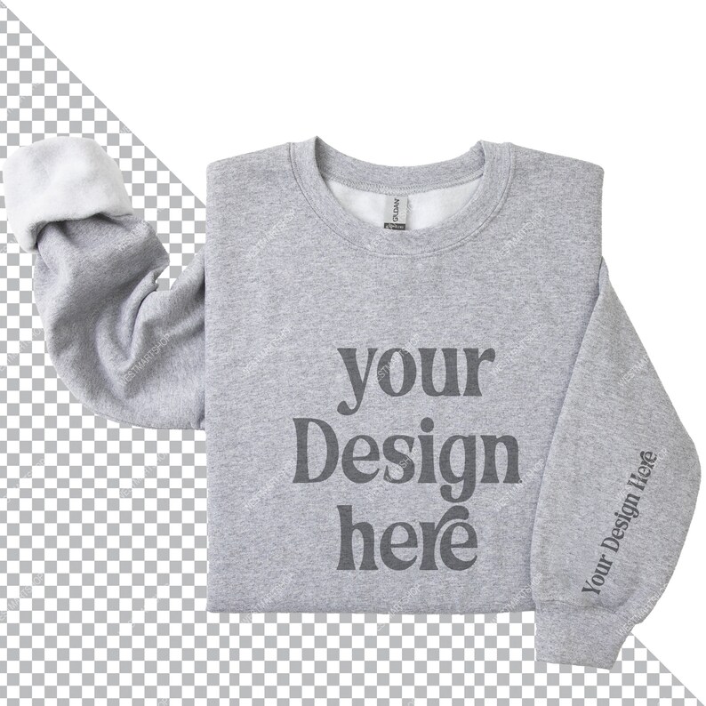 May include: A gray sweatshirt with the text "your design here" printed on the front. The sweatshirt is folded in half and the sleeves are rolled up.