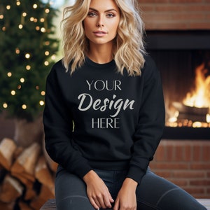 May include: A black sweatshirt with the text "YOUR Design HERE" printed on the front.