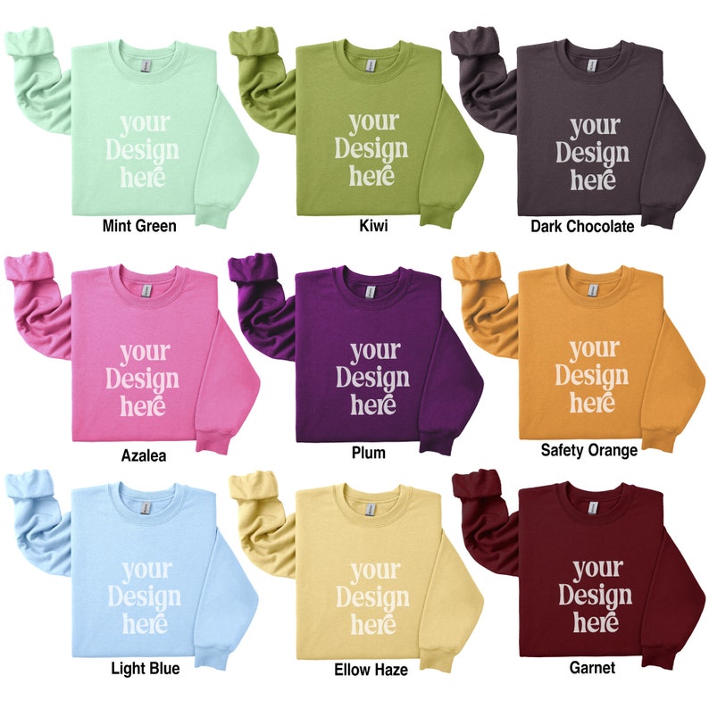 May include: Nine different color crew neck sweatshirts with the text "your design here" printed in white on the front. The colors are mint green, kiwi, dark chocolate, azalea, plum, safety orange, light blue, ellow haze, and garnet.