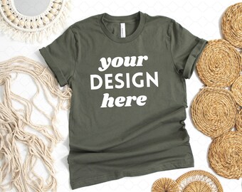 May include: A green t-shirt with the text "your design here" printed on the front.