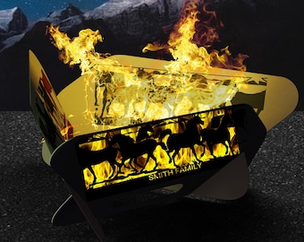 May include: A black metal fire pit with a cutout design of horses and the text "SMITH FAMILY". The fire pit is lit and the flames are visible.