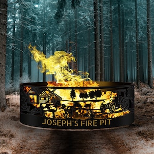 May include: A black metal fire pit with a cut-out design of a farm scene, including a windmill, a barn, a tractor, and trees. The fire pit is personalized with the text "JOSEPH'S FIRE PIT".